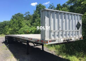 Aluminum flatbed semi trailer. 2004 Manac 48 foot trailer in great condition. Trailer for sale as seen with added bulkhead, new tool box and two dunnage racks. Has newer air tank and tires that are at about 70% - 80% tread. Great trailer ready to work. Unladen weight 9050 lbs.