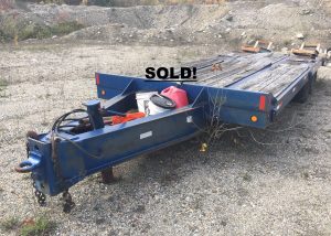 25 Ton Equipment Trailer. Heavy duty equipment trailer with air breaks. It has a 19 foot long by 102 inches wide flatbed with a 6 foot beaver tail and 6 foot ramps.
