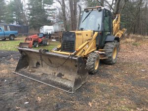 Ford 555-D Loader Backhoe. 1994 model 4 wheel drive backhoe with 5'677 hours. It has a Ford 4.2 liter 4 cylinder engine and 65 net horse power. The transmission is a 4 speed forward and reverse shuttle shift. Working 1 to 1 1/4 yard clam shell front bucket that has a 15 foot dumped bucket clearance. The hoe has a 14' 9" dig depth with a ditching bucket and additional 24" digging bucket. The backhoe also has an enclosed cab with power steering, new alternator installed in 2017, New batteries on 4/20 and new starter on 7/20. Breaks do not work and will need to be repaired. Starts and runs well.