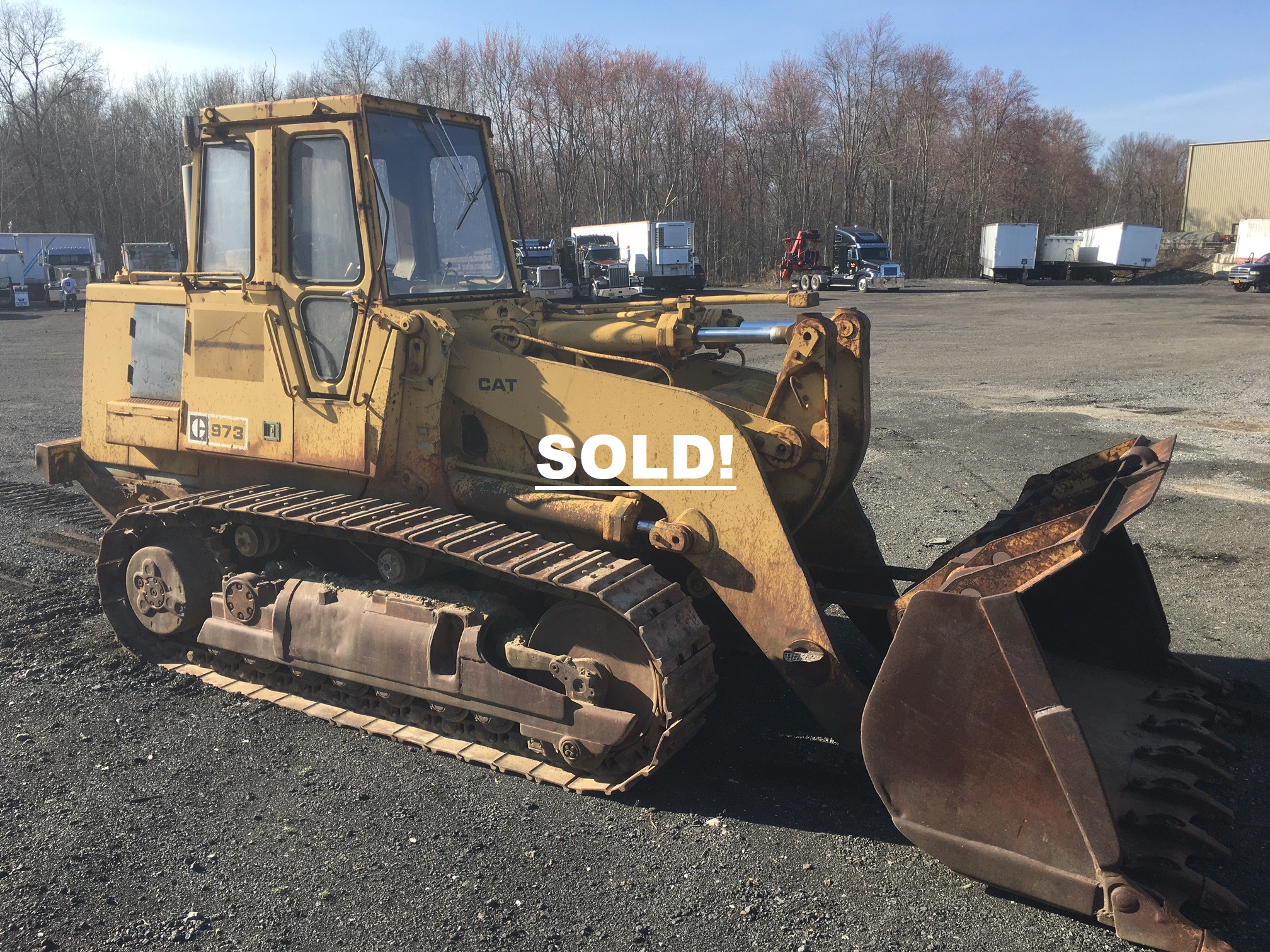 Caterpillar 973 Track Loader. 1994 turbo diesel 3306 engine with 210 horse power. Operating weight is 54'899 lbs. it's has a full height dump clearance of 10.96 ft. in. It's length is 23.37 ft. in. with bucket on the ground. the height is 11.24 ft. in. to top of cab. Left side track final drive does not work. Otherwise the track loader runs and operates as it should.