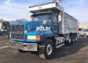 Mack Tri-Axle Dump Truck. 1998 CL-713 with an E7-427 V Mac Engine under 500k miles. 8 speed low/low Eaton Fuller transmission. Straight tri-axle “non steerable” Double frame. 46’000 lb. rears.  Empty weight 29K lbs. Legal haul weight 24 ton. Air ride suspension. J&J 24 yard aluminum side steel floor body measuring 19 1/2 feet long by 5 feet 8 inches high. Power bed tarp, mirror heat, power divider, Heat/AC, engine break. AM/FM/CD player.