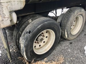 Spring suspension end dump trailer for sale.