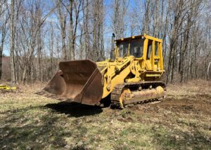 Caterpillar 977L Track Loader. Model year 1977 with a 6 cylinder 190 horsepower 3306 engine. Newer rollers, idlers and track tension pistons repacked. Enclosed ROPS. Approximate 4 - 4.5 yard bucket. Weight 47'641 lbs.
