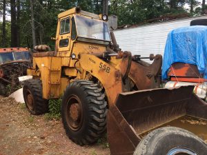 Michigan Clark Wheel Loader. 1975 tire wheel loader. Rebuilt 6 cylinder Cummins diesel engine. Three speed transmission. Repacked lift pistons. Operating weight approximately 23'708 lbs.