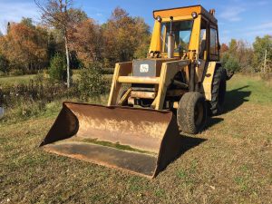 Used older John Deere front loader backhoe for sale.