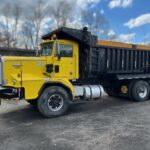 1986 Kenworth Dump Truck. Model C520 has a big cam 315 Cummins motor turned up to 475 hp with a low flow coolant system. 376,125 metered miles. Eight speed Eaton Fuller transmission with low, low. 22,000 lb. front axle. Double frame. Heavy duty 46,000 lb. Rockwell rear axle and Hendrickson heavy duty spring suspension with a 5.29 gear ratio. New bearings and brakes. Three stage engine brake.  75 mph highway speed. Approximate 24 yard 17 foot long Fruehauf bathtub body. GVWR 68,000 lbs. Empty weight 30,000 lbs.