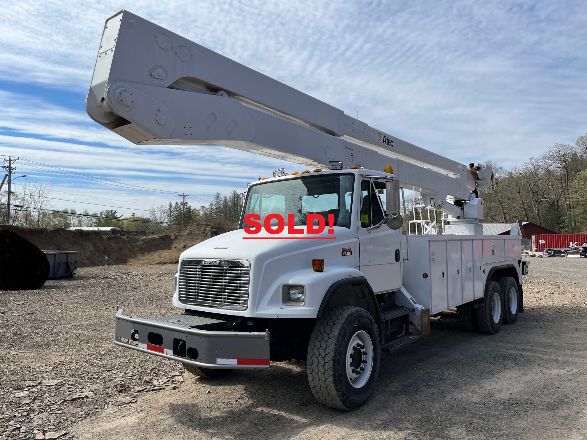 Freightliner FL80 Bucket Truck. The truck is a 2001 and is an 82' Altec aerial unit. The upper boom has a 7' telescopic extension. It's equipped with a two man bucket and material handler winch. There are upper and lower controls with 4 outriggers to stabilize the unit. The trucks chassi and body are super clean. All tires are in excellent condition with deep tire tread. The trucks powered by a Caterpillar 3126 diesel engine. The transmission is a Allison automatic. PTO hours are 7010. The truck is also equipped with selectable on demand four wheel drive (6x6) with differential locks. The mileage is low at only 16,555 miles and the unit has been fleet maintained. The boom has been certified by American Aerial in Amsterdam NY. The entire unit is needing nothing and completely turn key work ready.  Backed by all maintenance, repair and upgrade documents.