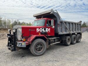 Autocar Tri-axle Dump Truck. 1973 DC Triable model tri-axle with a rebuilt big cam 350 Cummins diesel engine and a rebuilt 8 speed low low transmission. the truck has 20,000 lb. fronts, 58,000 lb. rears and a 65,000 lb. Hendrickson walking beam suspension with walking beams. All bushings are tight. The tires are 24.5 rubber on the rear. It's a full double frame dump truck.