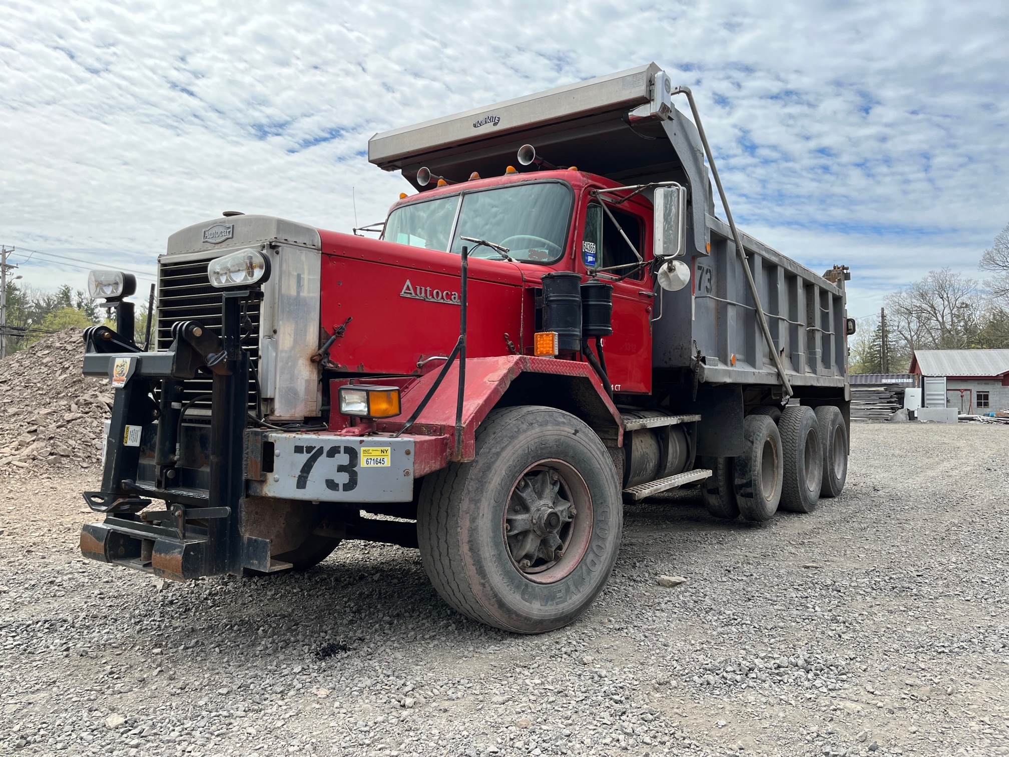 Autocar Tri-axle Dump Truck. 1973 DC Triable model tri-axle with a rebuilt big cam 350 Cummins diesel engine and a rebuilt 8 speed low low transmission. the truck has 20,000 lb. fronts, 58,000 lb. rears and a 65,000 lb. Hendrickson walking beam suspension with walking beams. All bushings are tight. The tires are 24.5 rubber on the rear. It's a full double frame dump truck.