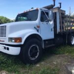 1990 International Flatbed Truck. 7.3 V8 diesel engine with 169,657 miles. Automatic Allison transmission. Air ride rear suspension. 12 foot long bed. 95" inches wide to the pockets. 236 inch wheel base.