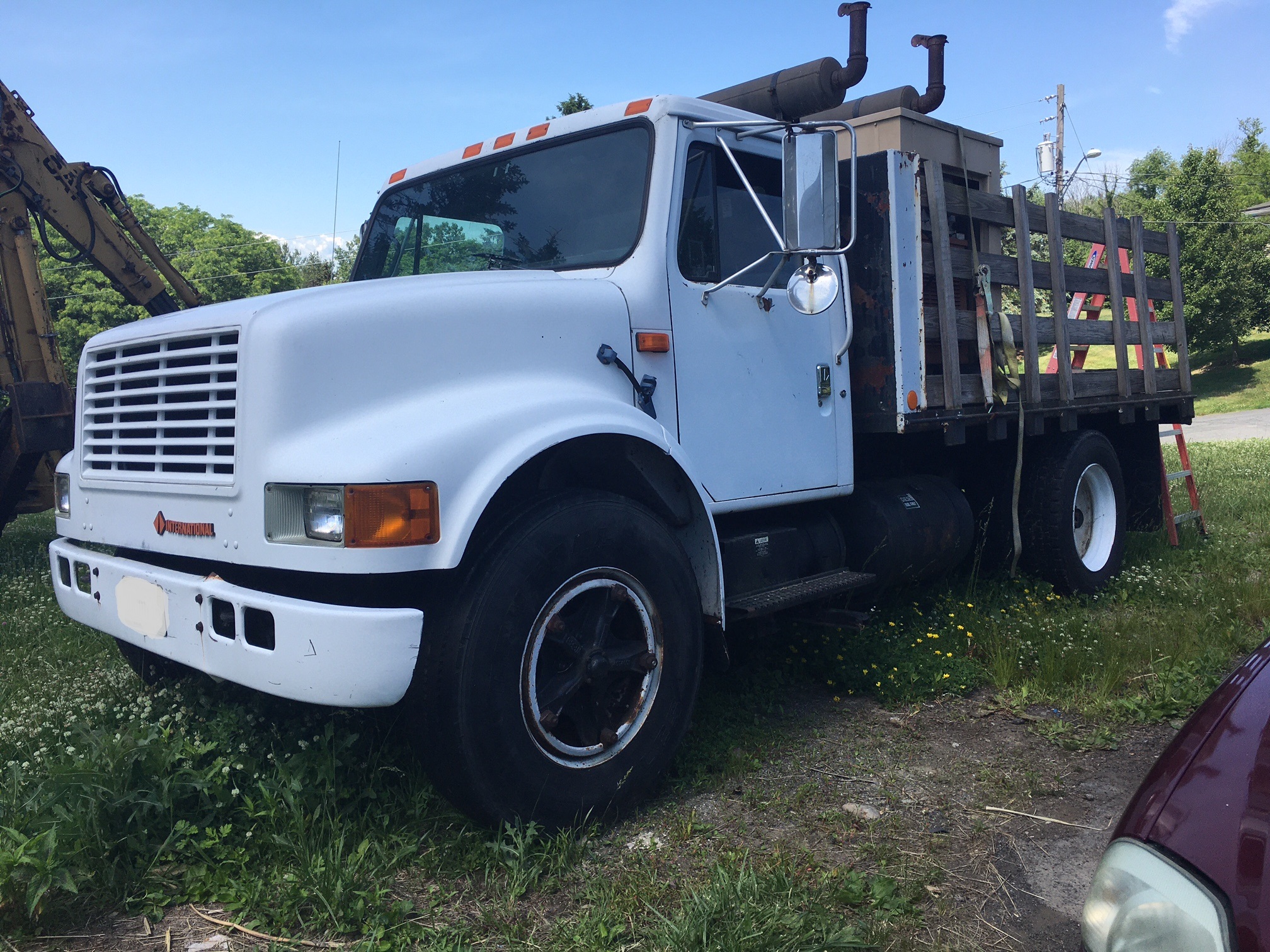 1990 International Flatbed Truck. 7.3 V8 diesel engine with 169,657 miles. Automatic Allison transmission. Air ride rear suspension. 12 foot long bed. 95" inches wide to the pockets. 236 inch wheel base.