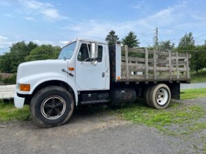 1990 International flatbed work truck for sale.