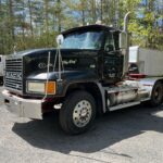 Mack CL733 Day Cab. 2001 model heavy spec. Double frame. The engine is a Cummins Signature 600. It has 407,040 miles and 12,077 hours. The engine will need work. A spun bearing will require a new crankshaft or to have the one in it machined back to repair. Additionally it's questionable as to weather the block will need line boring or not. The transmission is a Fuller Eaton 18 speed. Front axle weight is 12,860 and the rears are 44K lbs. This Mack CL733 was being used to haul dump trailers and therefor is set up with the necessary wet line and in cab pump and PTO control equipment. The semi's interior would likely require a shampoo and detail but is in otherwise beautiful condition without any rips or tares as can bee seen in the photos. GVWR is 56,860.