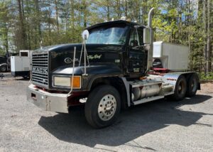 Mack CL733 Day Cab. 2001 model heavy spec. Double frame. The engine is a Cummins Signature 600. It has 407,040 miles and 12,077 hours. The engine will need work. A spun bearing will require a new crankshaft or to have the one in it machined back to repair. Additionally it's questionable as to weather the block will need line boring or not. The transmission is a Fuller Eaton 18 speed. Front axle weight is 12,860 and the rears are 44K lbs. This Mack CL733 was being used to haul dump trailers and therefor is set up with the necessary wet line and in cab pump and PTO control equipment. The semi's interior would likely require a shampoo and detail but is in otherwise beautiful condition without any rips or tares as can bee seen in the photos. GVWR is 56,860.