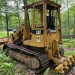 Caterpillar 939C Crawler Loader. A 1999 year model track loader with 1,928 hours on a Caterpillar 3046 turbocharged 6-cylinder  90 hp engine. The machine is equipped with a Hystat transmission and weighs approximately 22,000 lbs.  The crawler also comes with the benefit of a 4 in 1 clamshell loader bucket in addition to a Caterpillar No. 3 ripper implement attachment. The dimensions for shipping are as follows: Length of crawler with the bucket on the ground 14.3 ft in. Width to outside of the tracks 6.42 ft in. The height to the top of the cab is 9.08 ft in.