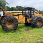 John Deere 640D Log Skidder: 1987 JD 640d cable log skidder with a John Deere 6-414t engine re-sleeved in the early 2000s. It has 28,632 total hours on the machine. The transmission is a power shift with 8 forward and 4 reverse gears. It has articulated frame steering. The foot brake is a week and may need attention. The hand brake works fine. The John Deere 640d logging skidder is chained up! It has an operating weight of 20,180 lbs, a wheelbase of 113 inches, and a 19.2-inch clearance.