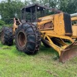 John Deere 640D Log Skidder: 1987 JD 640d cable log skidder with a John Deere 6-414t engine re-sleeved in the early 2000s. It has 28,632 total hours on the machine. The transmission is a power shift with 8 forward and 4 reverse gears. It has articulated frame steering. The foot brake is a week and may need attention. The hand brake works fine. The John Deere 640d logging skidder is chained up! It has an operating weight of 20,180 lbs, a wheelbase of 113 inches, and a 19.2-inch clearance.