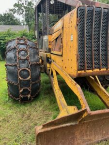 John Deere 640D Log Skidder: 1987 JD 640d cable log skidder with a John Deere 6-414t engine re-sleeved in the early 2000s. It has 28,632 total hours on the machine. The transmission is a power shift with 8 forward and 4 reverse gears. It has articulated frame steering. The foot brake is a week and may need attention. The hand brake works fine. The John Deere 640d logging skidder is chained up! It has an operating weight of 20,180 lbs, a wheelbase of 113 inches, and a 19.2-inch clearance.