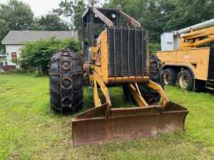 John Deere 640D Log Skidder: 1987 JD 640d cable log skidder with a John Deere 6-414t engine re-sleeved in the early 2000s. It has 28,632 total hours on the machine. The transmission is a power shift with 8 forward and 4 reverse gears. It has articulated frame steering. The foot brake is a week and may need attention. The hand brake works fine. The John Deere 640d logging skidder is chained up! It has an operating weight of 20,180 lbs, a wheelbase of 113 inches, and a 19.2-inch clearance.