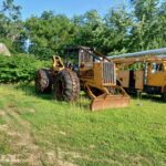 John Deere 640D Log Skidder: 1987 JD 640d cable log skidder with a John Deere 6-414t engine re-sleeved in the early 2000s. It has 28,632 total hours on the machine. The transmission is a power shift with 8 forward and 4 reverse gears. It has articulated frame steering. The foot brake is a week and may need attention. The hand brake works fine. The John Deere 640d logging skidder is chained up! It has an operating weight of 20,180 lbs, a wheelbase of 113 inches, and a 19.2-inch clearance.