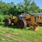 John Deere 640D Log Skidder: 1987 JD 640d cable log skidder with a John Deere 6-414t engine re-sleeved in the early 2000s. It has 28,632 total hours on the machine. The transmission is a power shift with 8 forward and 4 reverse gears. It has articulated frame steering. The foot brake is a week and may need attention. The hand brake works fine. The John Deere 640d logging skidder is chained up! It has an operating weight of 20,180 lbs, a wheelbase of 113 inches, and a 19.2-inch clearance.