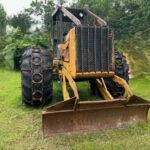 John Deere 640D Log Skidder: 1987 JD 640d cable log skidder with a John Deere 6-414t engine re-sleeved in the early 2000s. It has 28,632 total hours on the machine. The transmission is a power shift with 8 forward and 4 reverse gears. It has articulated frame steering. The foot brake is a week and may need attention. The hand brake works fine. The John Deere 640d logging skidder is chained up! It has an operating weight of 20,180 lbs, a wheelbase of 113 inches, and a 19.2-inch clearance.